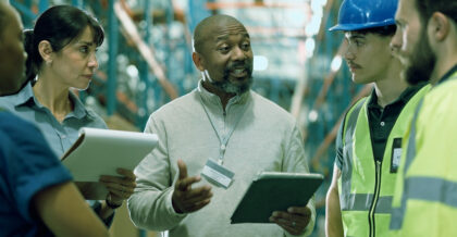 Logistics, team or supervisor planning with tablet for service delivery, storage control or inspection. People, warehouse inspector and staff meeting with tech for order update, shipping and feedback