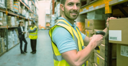 a warehouse worker scanning a package dtc ecommerce fufillment