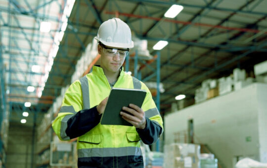 Businessman, logistics and checking inventory with tablet in warehouse for supply chain or stock.